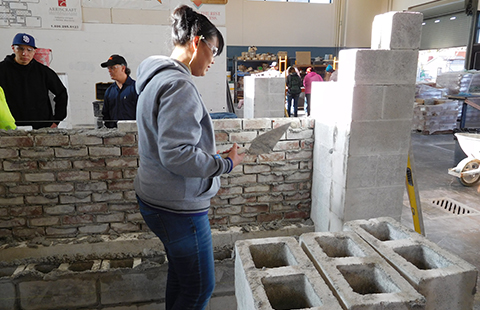 TVTC student learning masonry techniques in class.