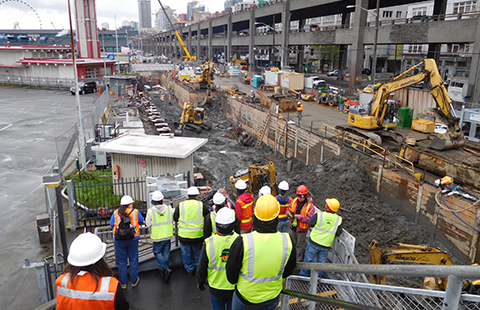 Tulalip Vocational Training Center students observing construction techniques on a Seattle field trip.