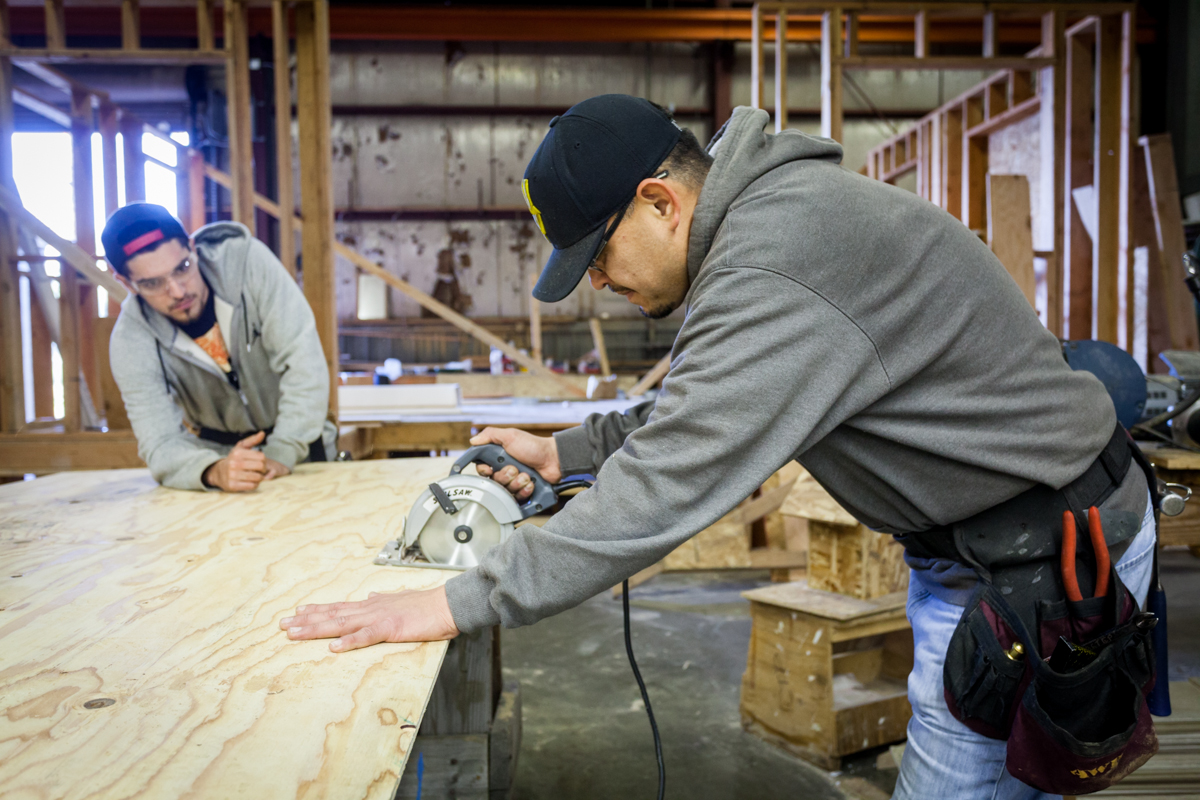 Two students of TERO Vocational Training Center working on an electrical project.